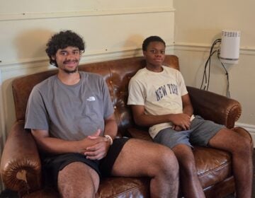 Meno Dwyer and Seth Akuaku sit and smile