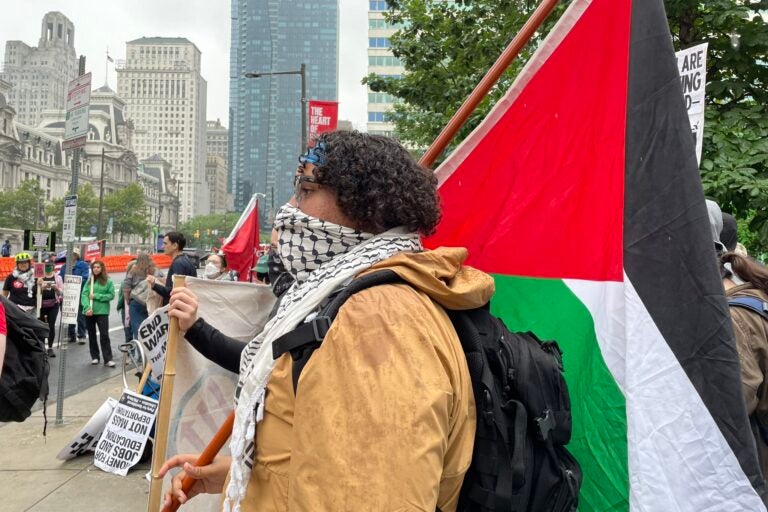 Mike Madera, of Philadelphia, is part of the pro-Palestine contingent of the protest and has been working with people affected on the ground by Israel’s war in Gaza. He called on Philadelphians to march in solidarity with Palestinians. (Emily Neil/WHYY)