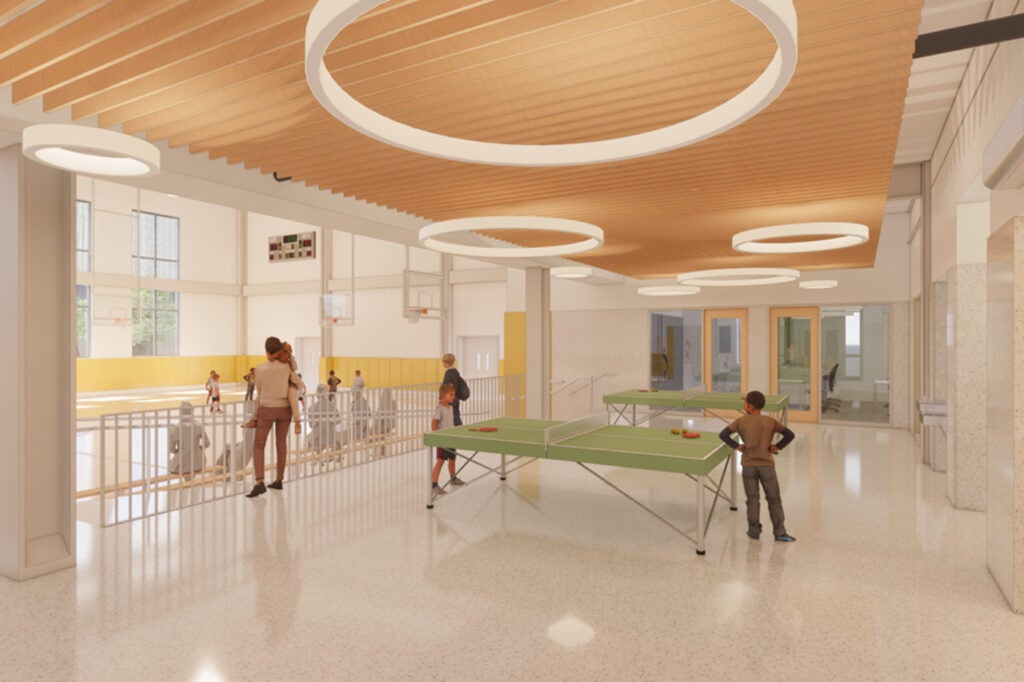 a rendering of a recreation room, with two ping pong tables and a basketball court, in the proposed 22nd Police District
