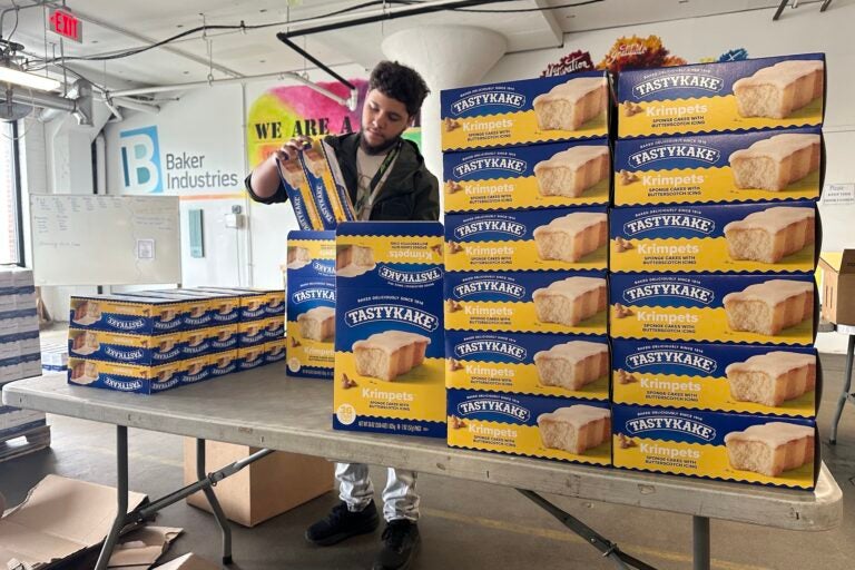 Boxes of Tastykakes stacked on a table