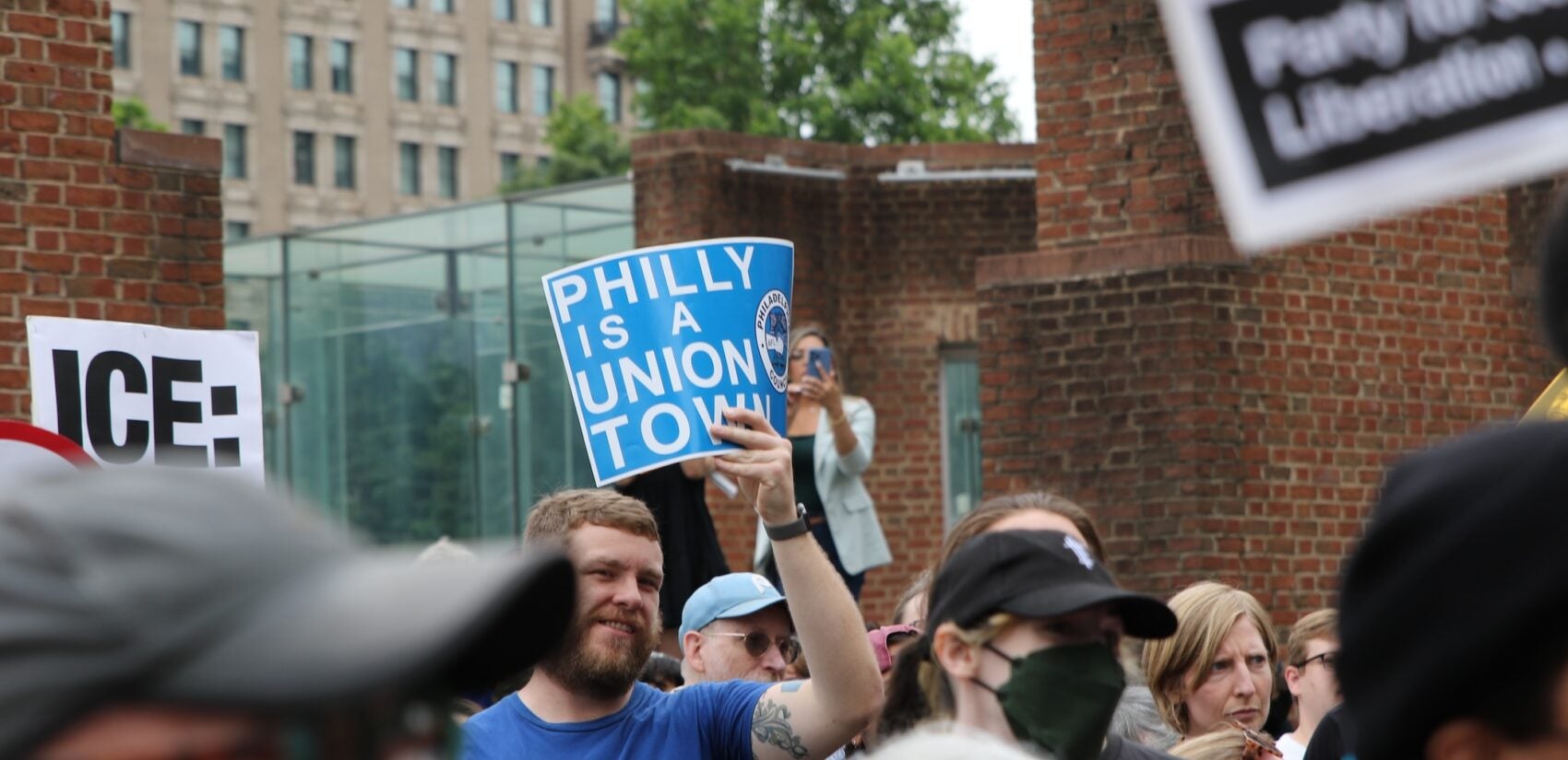 anti-ice-protest-philly-c-sharber-2025-06-09-01 People holding up signs as they gather at the protest