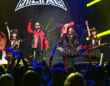 Members of the band BABYMETAL perform on stage