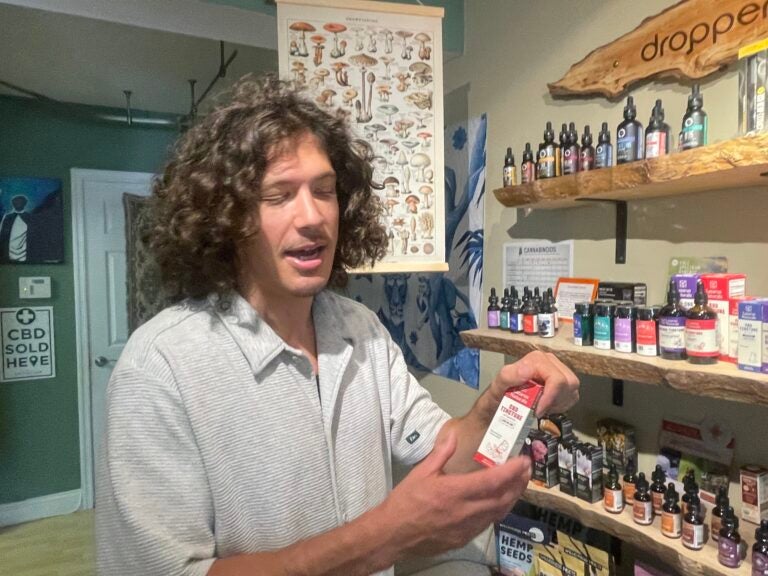 del-marijuana-thc-c-barrish-2025-06-06-01 Jesse Ginefra holding up a product in the store