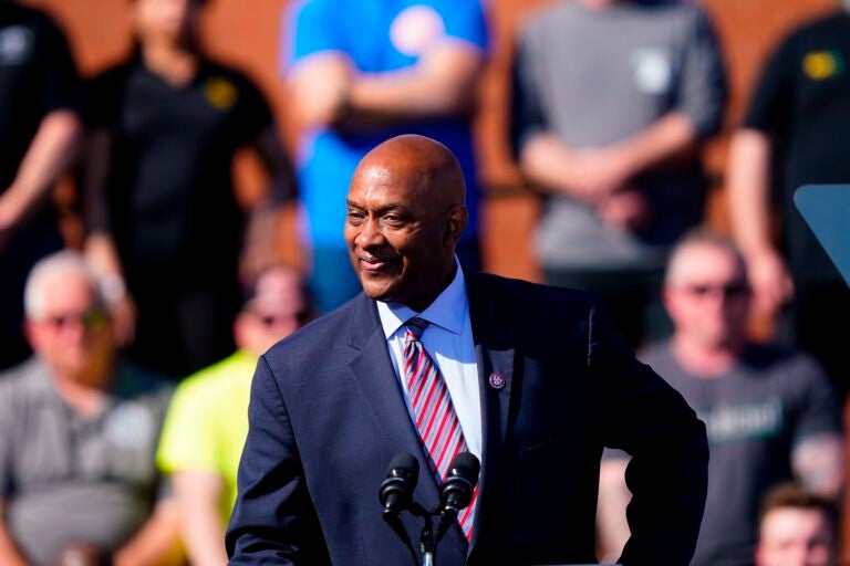 Harris Dwight Evans speaking at a podium at an outdoor event