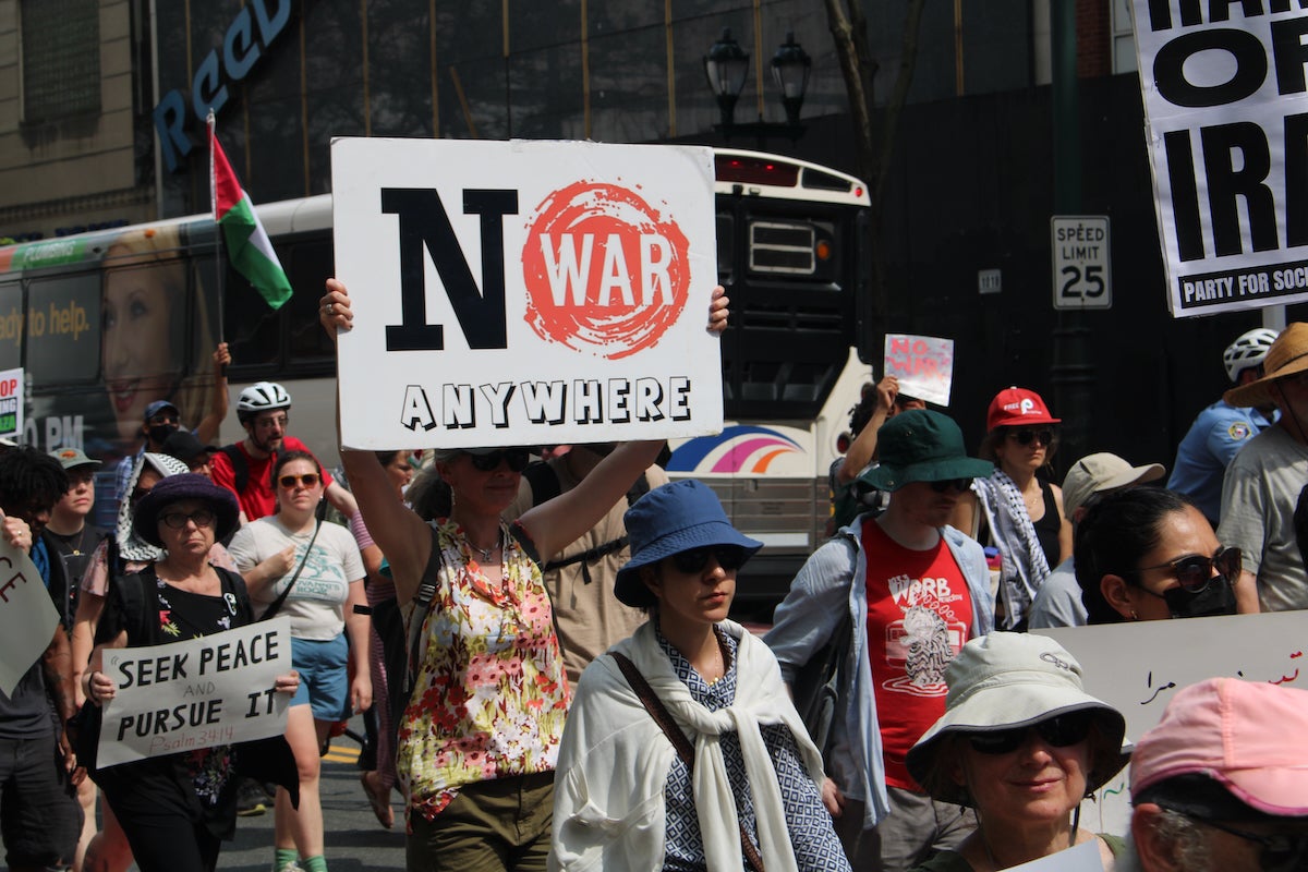 no-war-on-iran-5-copy A person holds a sign during a march in Philadelphia that reads