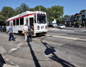 People boarding trolley at 58th Street and Cobbs Creek Parkway