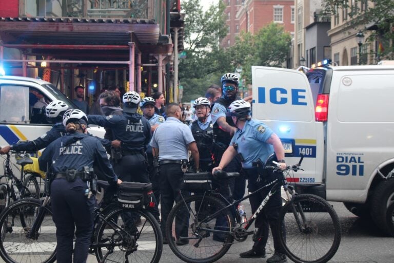 Police officers confronting protesters in the street
