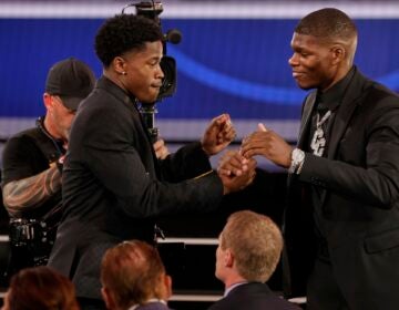 VJ Edgecombe, left, is congratulated