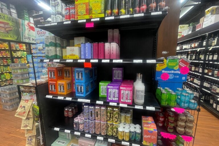 shelves stocked with beverages in a store