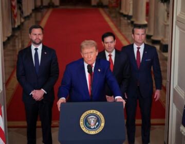 Trump speaking at a podium