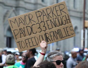 Union members and supporters marched around City Hall