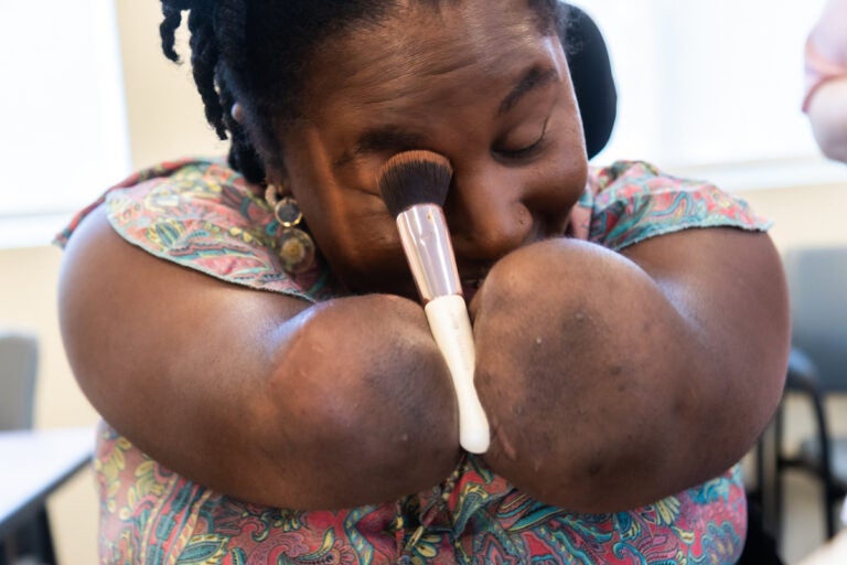 Candice Davis applies make up using specialized tools