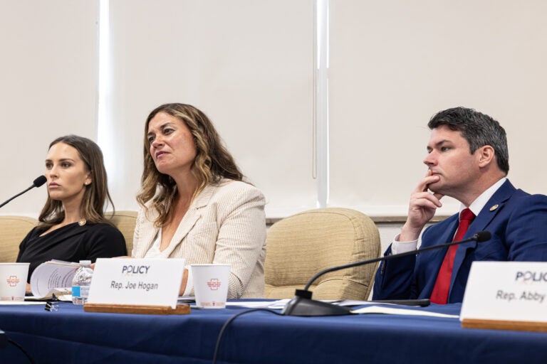 Shelby Labs, Kristin Marcell and Joe Hogan look on