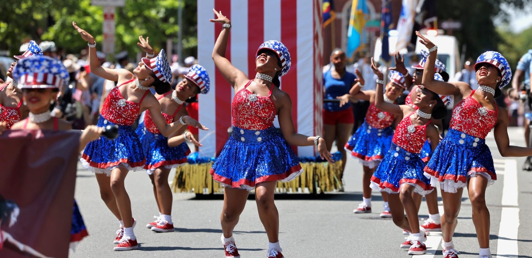 2025 07 04-e lee-philadelphia-4th of july parade dancers Women wearing American flag-themed dresses dance during the Philadelphia Fourth of July parade.