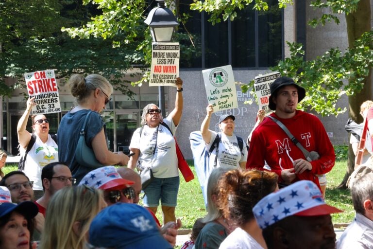 Striking municipal workers chant during Mayor Cherelle Parker's speech at the Celebration of Freedom ceremony at Independence Hall.