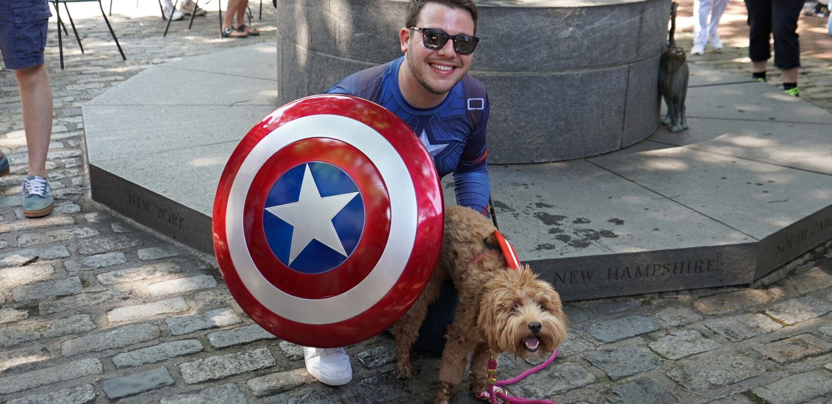 2025 07 04-n kariuki-betsy ross house pet parade michael penzel lunabelle A man dressed as Captain America and his dog
