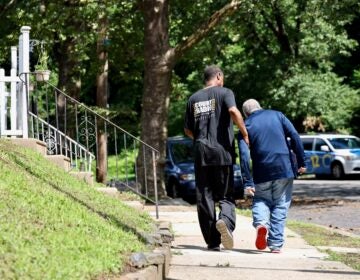 The Senior Companion Program's Joseph Dennis walks with James Henry