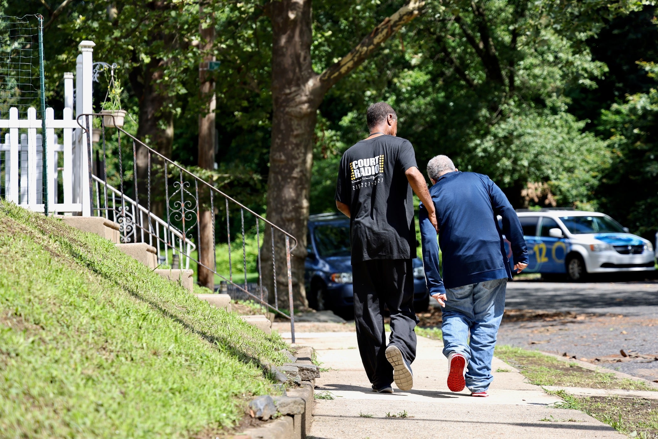 The Senior Companion Program's Joseph Dennis walks with James Henry