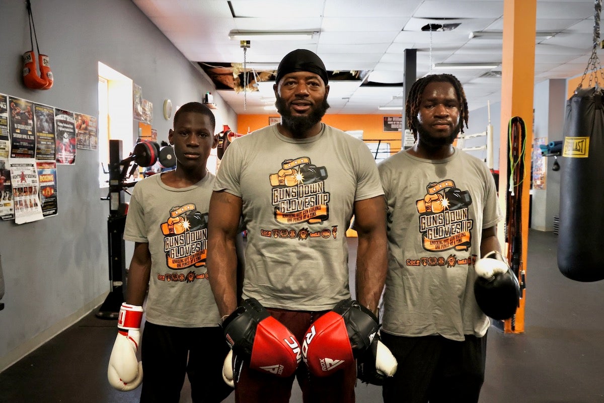 Michael Hilton (center) with participants Aaron Geddes, 11 (left), and D'Andre Marks (right)