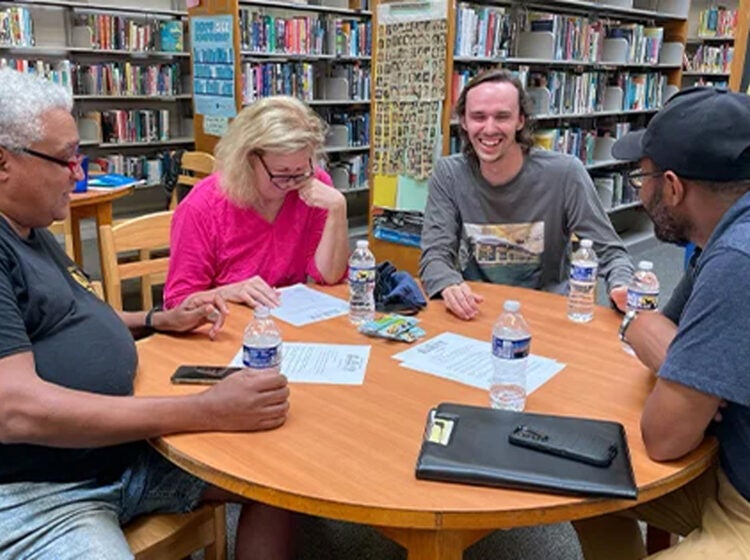 Residents are seen engaging in conversation at a Bridging Blocks event.