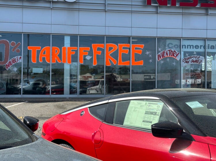 A Tariff Free sign to attract vehicle shoppers is at an automobile dealership in Totowa, N.J., on April 30, 2025. (AP Photo/Ted Shaffrey)