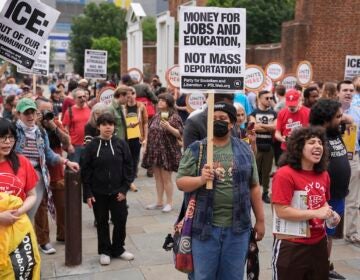 People gather to protest the deployment of the National Guard in Los Angeles and the detainment of union leader David Huerta near Independence Hall in Philadelphia, Monday, June 9, 2025. (AP Photo/Matt Rourke)