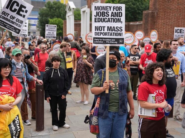 People gather to protest the deployment of the National Guard in Los Angeles and the detainment of union leader David Huerta near Independence Hall in Philadelphia, Monday, June 9, 2025. (AP Photo/Matt Rourke)