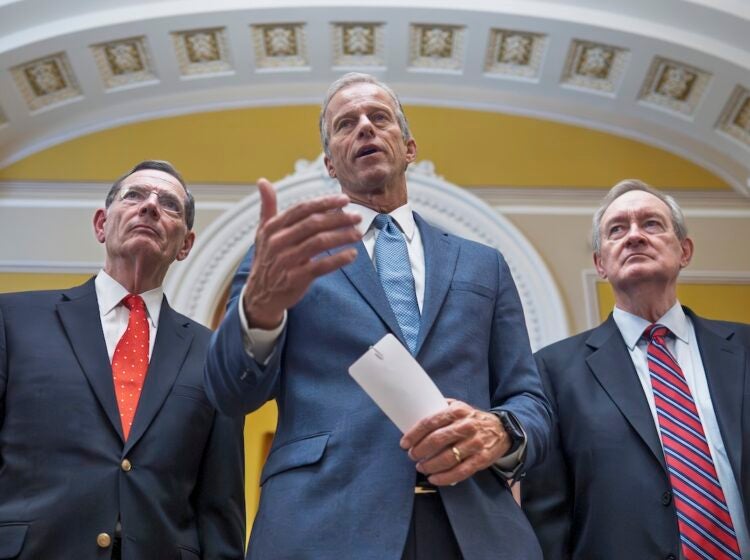 Senate Majority Leader John Thune, R-S.D., is flanked by Sen. John Barrasso, R-Wyo., the GOP whip, left, and Finance Committee Chairman Mike Crapo, R-Idaho, speaks to reporters after passage of the budget reconciliation package of President Donald Trump's signature bill of big tax breaks and spending cuts, at the Capitol in Washington, Tuesday, July 1, 2025. (AP Photo/J. Scott Applewhite)