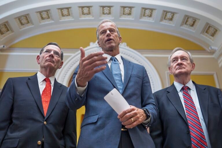 Congress Tax Cuts Senate Majority Leader John Thune, R-S.D., is flanked by Sen. John Barrasso, R-Wyo., the GOP whip, left, and Finance Committee Chairman Mike Crapo, R-Idaho, speaks to reporters after passage of the budget reconciliation package of President Donald Trump's signature bill of big tax breaks and spending cuts, at the Capitol in Washington, Tuesday, July 1, 2025. (AP Photo/J. Scott Applewhite)