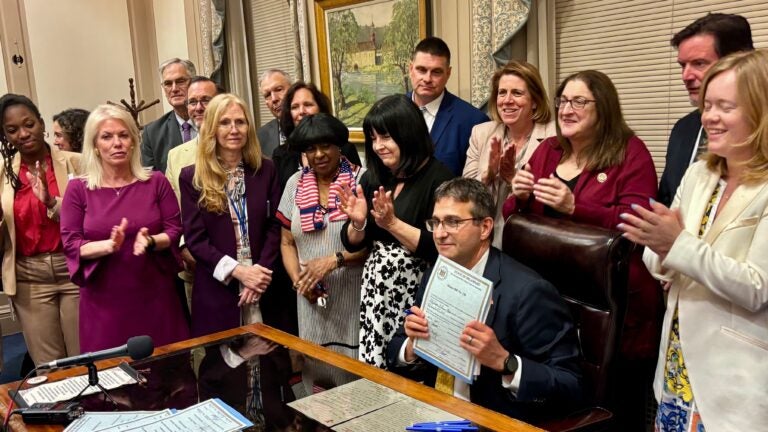 Delaware-legislative-session-2025-07-01-4 Matt Meyer holds up signed fiscal year 2026 budget legislation