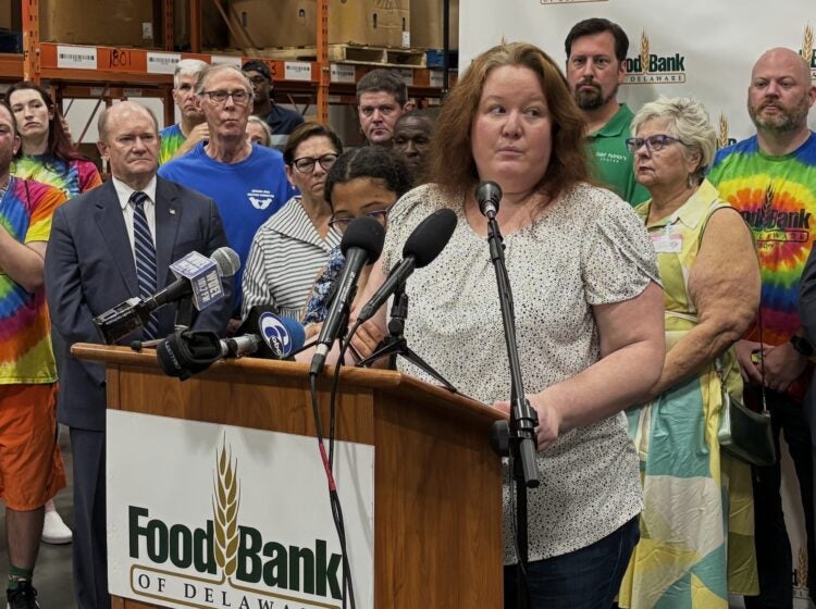 Elizabeth Morales speaking at a podium