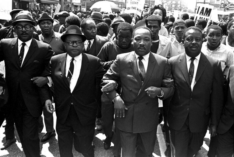 MLK Documents Ralph Abernathy and Bishop Julian Smith flank Dr. Martin Luther King during a civil rights march