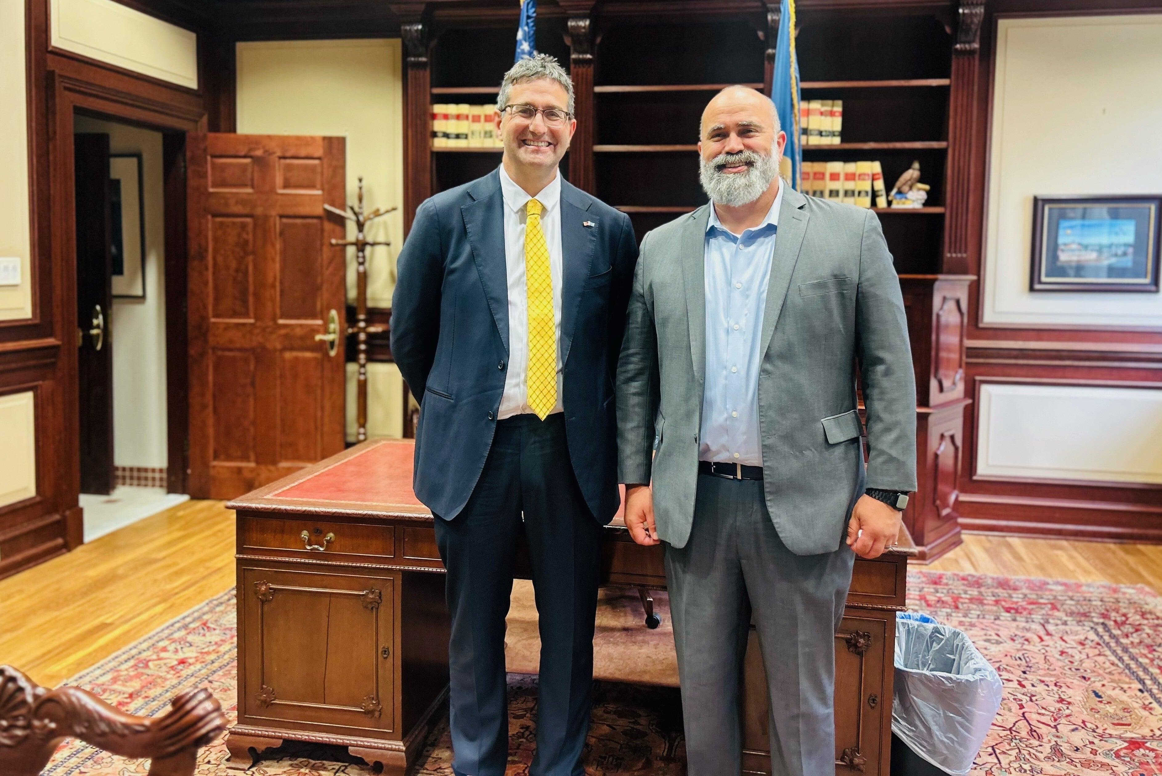 Matt Meyer stands next to Marijuana Commissioner Joshua Sanderlin