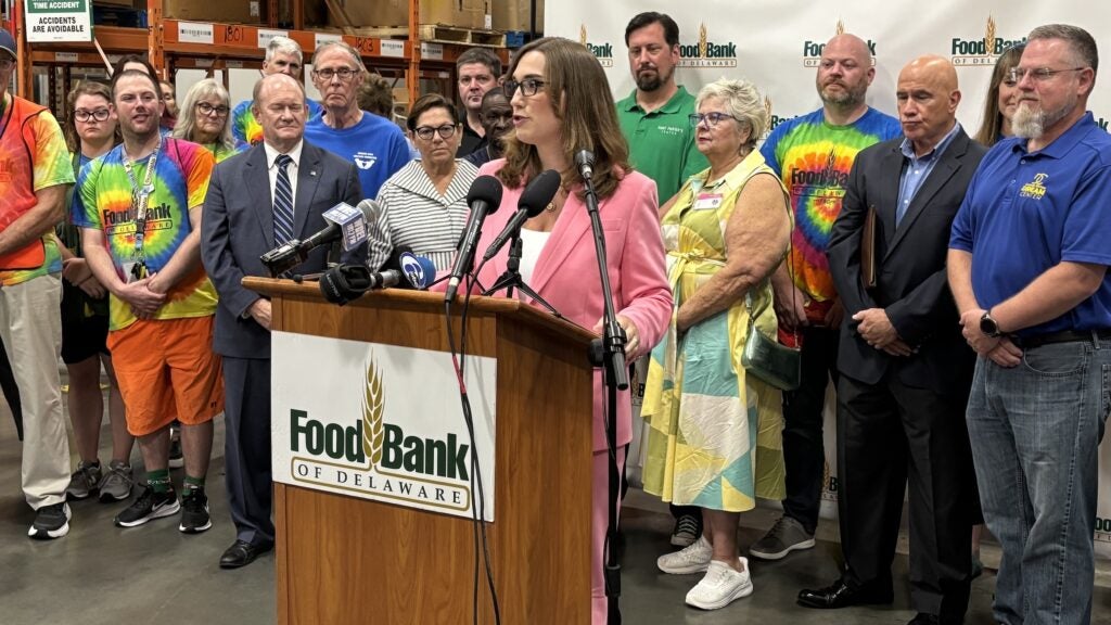 Sarah McBride speaking at a podium