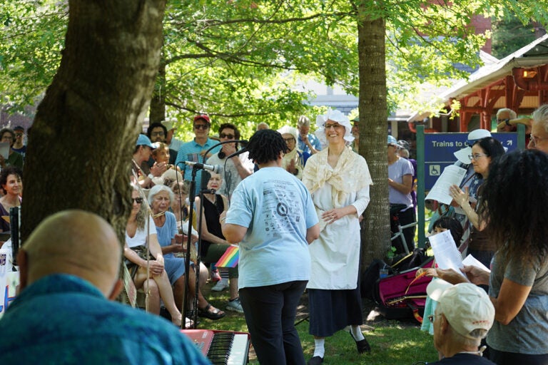Womens_march_mount_airy2_07042025 A crowd listens to a speaker talk about how the Trump administration's action undermine the country's founding principles.