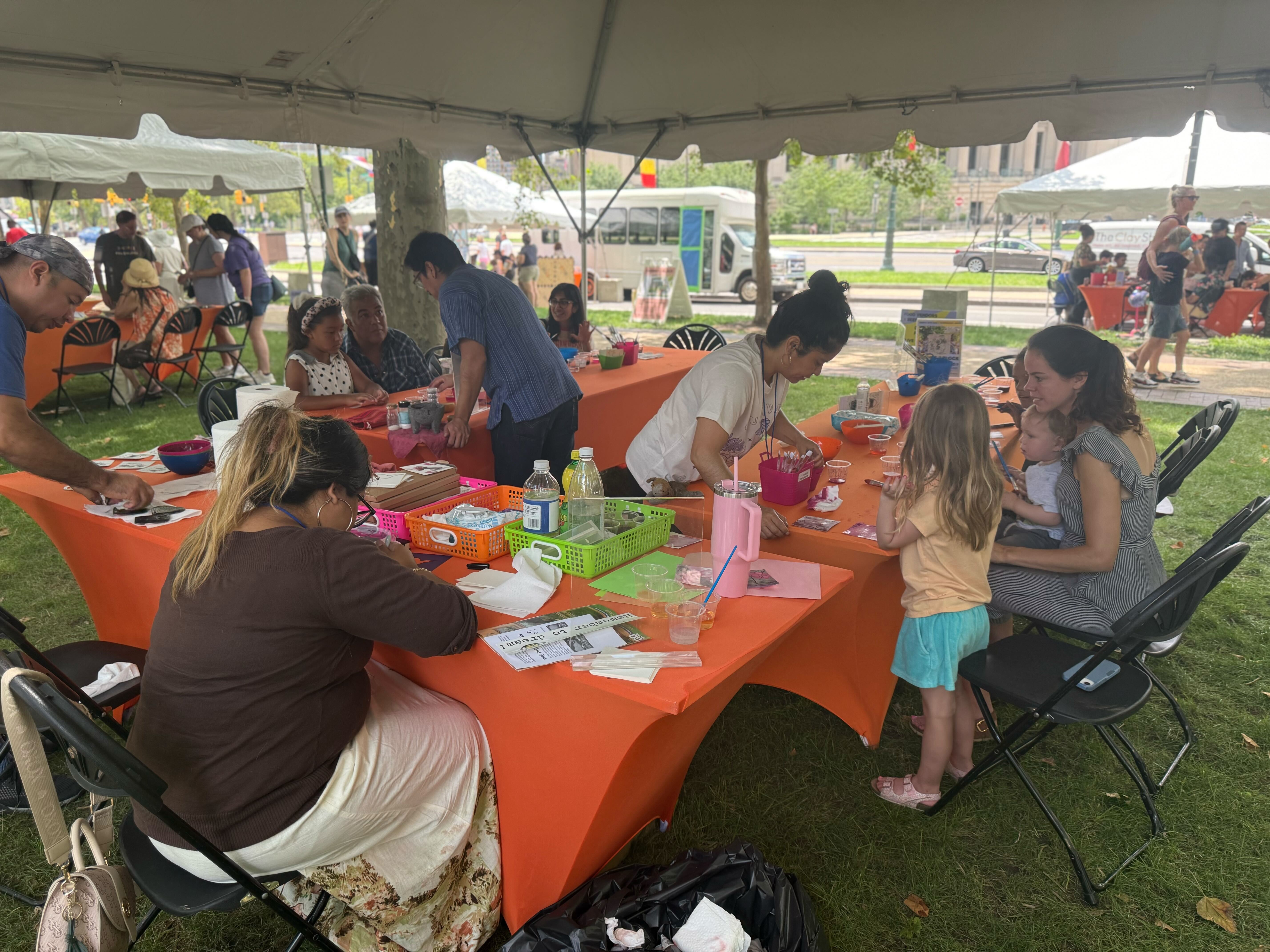 a table with families creating art