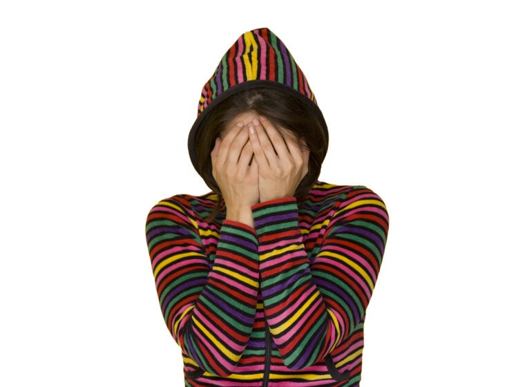 a teenage girl with shame isolated on white