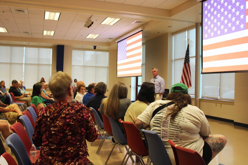 Bob Harvie answers questions from attendees at a Horsham town hall