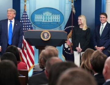 President Donald Trump, from left, Attorney General Pam Bondi and Deputy Attorney General Todd Blanche standing