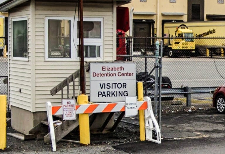 a sign reads Elizabeth Detention Center VISITOR PARKING