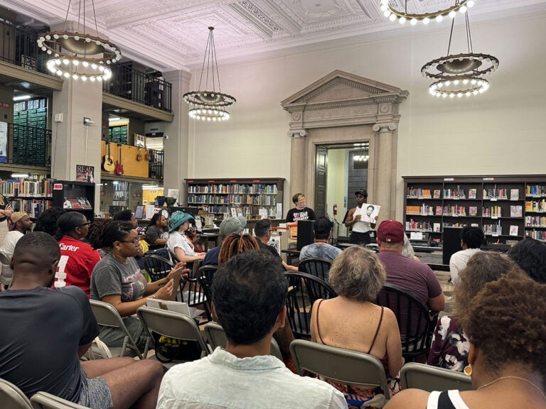 free_library_philadelphia_vinyl_wednesdays_07042025 People gather for a vinyl club meeting in one of Philadelphia's libraries