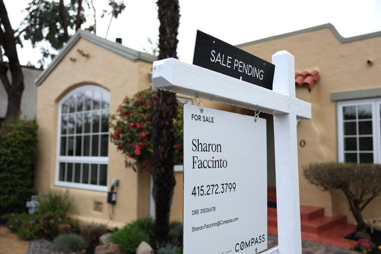Pre-Existing Home Prices Dropped For First Time In 11 Years In February A for sale sign sits outside of a house