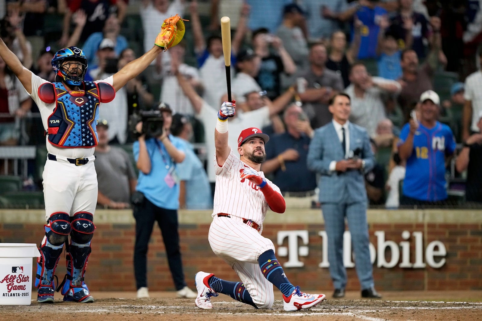 Philadelphia Phillies Kyle Schwarber celebrates after winning the tiebreaker at the MLB baseball All-Star game between the American League and National League, Tuesday, July 15, 2025, in Atlanta.