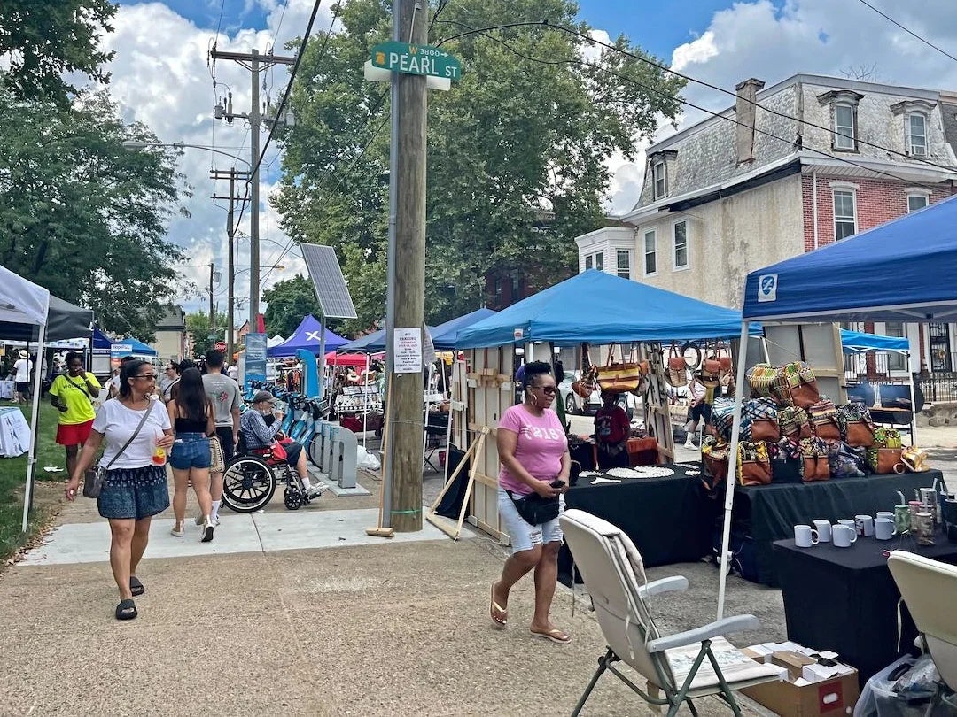 People and the row of vendors at the Lancaster Avenue Jazz and Arts Festival