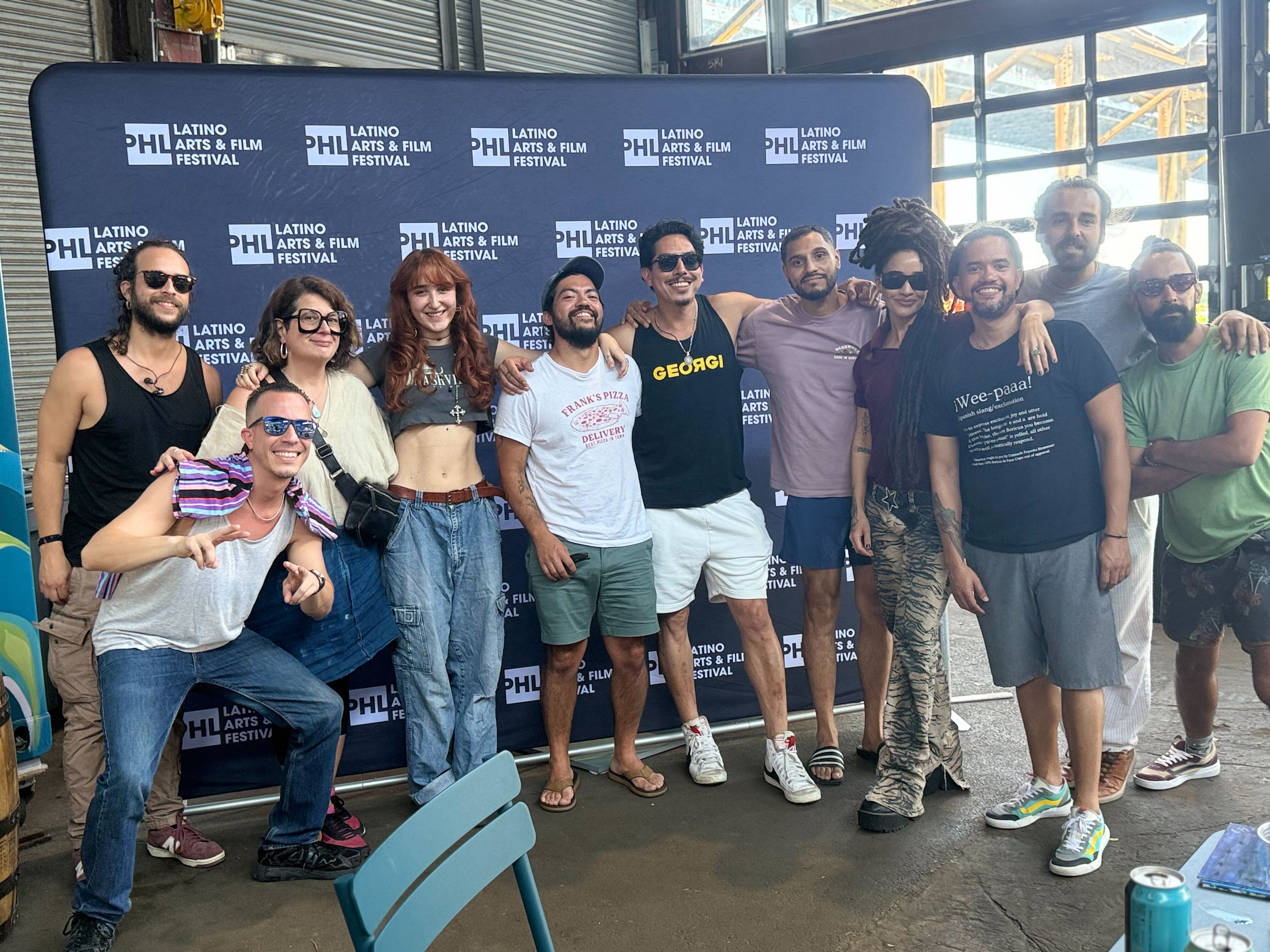 Artists, organizers, and members of the Latino Arts and Film Festival pose for a group picture