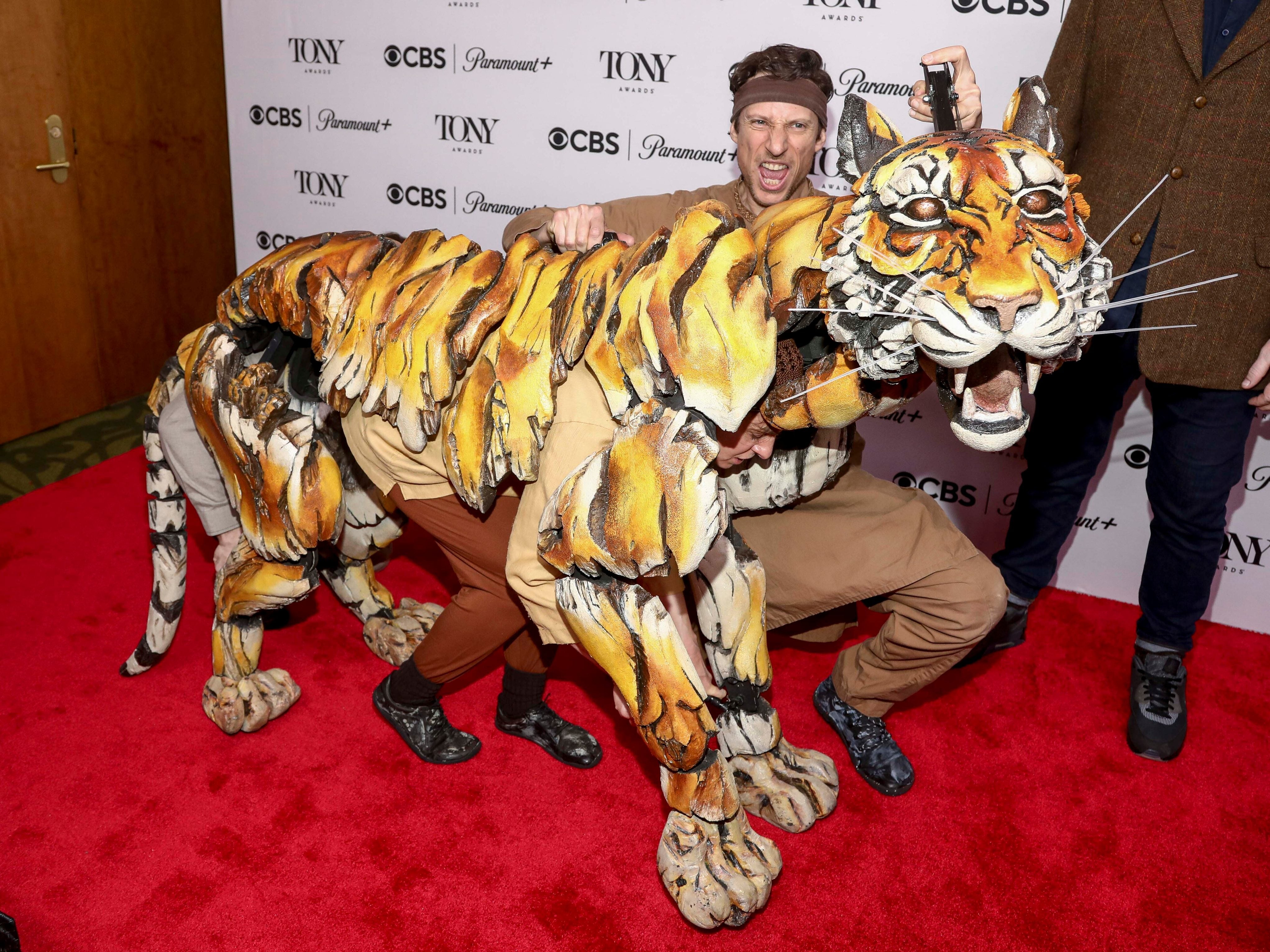 Puppeteers from The Life of Pi pose on the red carpet