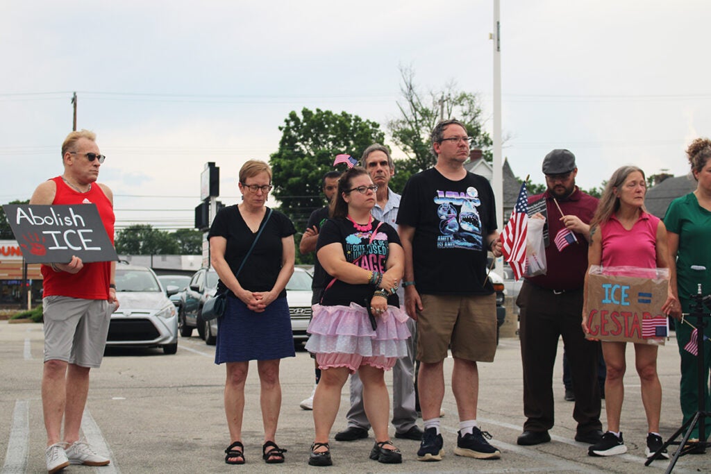 Community members speak out at a vigil
