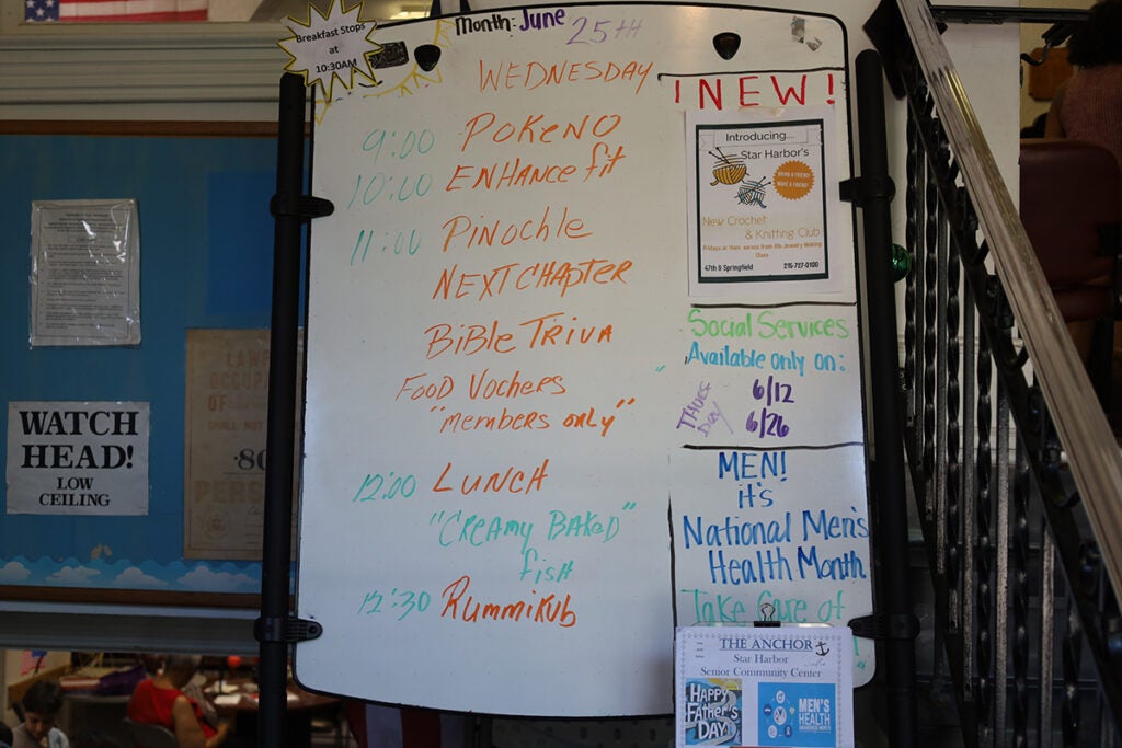 A whiteboard at the North Light Community Center shows the schedule for the day