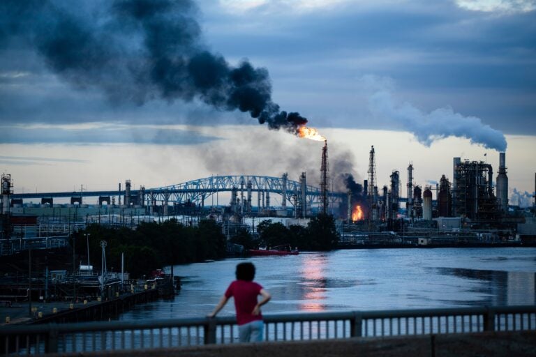 pes-refinery-fire-philadelphia-2019-06-21-ap-hydrogen-fluoride a child looks on at the Philadelphia Energy Solutions fire