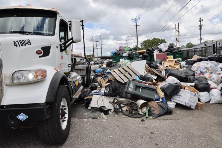 Trash overflows the dumpsters at the intersection of Snyder and Point Breeze avenues